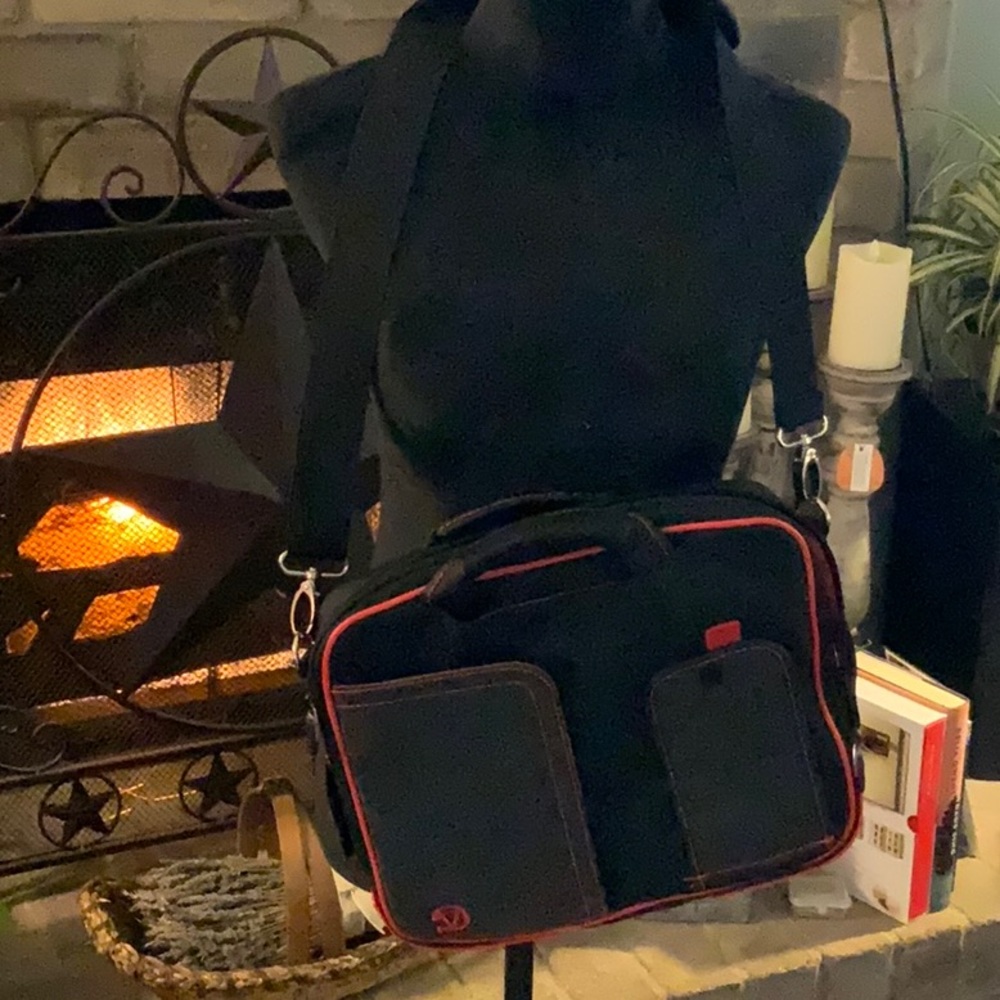 Travel messenger bag, black trim red.New condition.